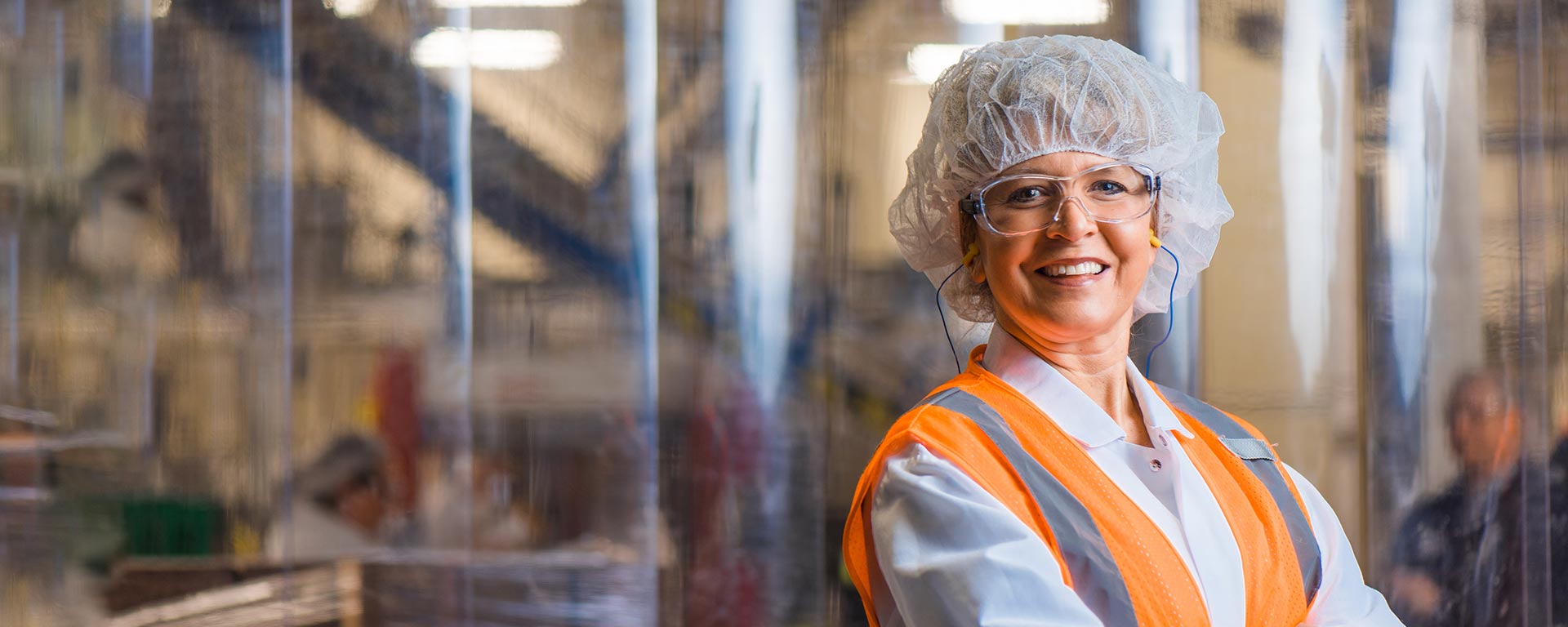 Smiling employee wearing a hair net